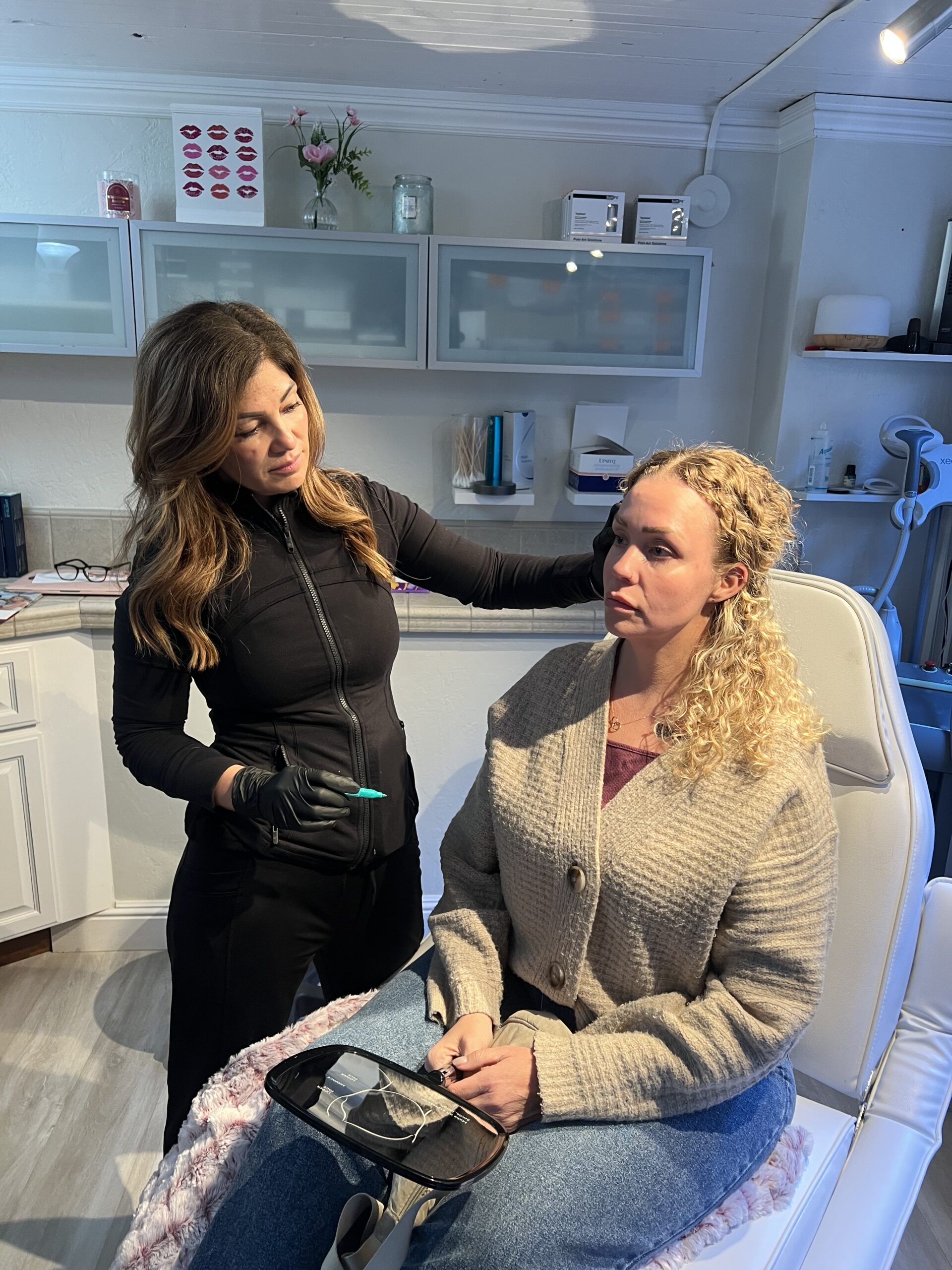 Medical professional consulting with a patient during an aesthetic treatment visit in Tracy, CA | A Perfect Finnish Medical Spa